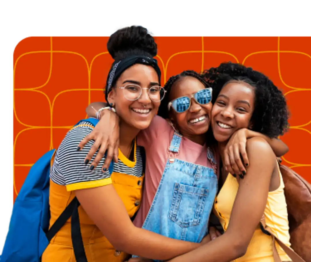 Three girls hugging each other