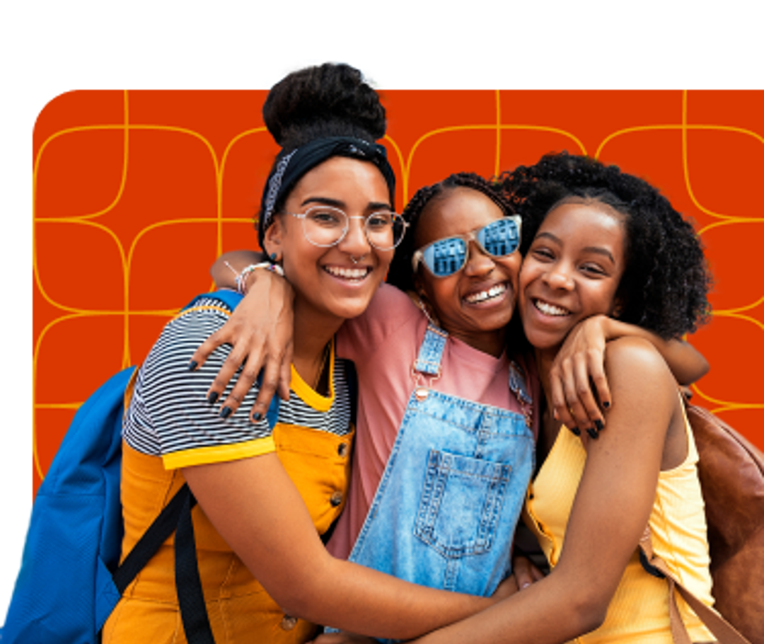 Three girls hugging each other