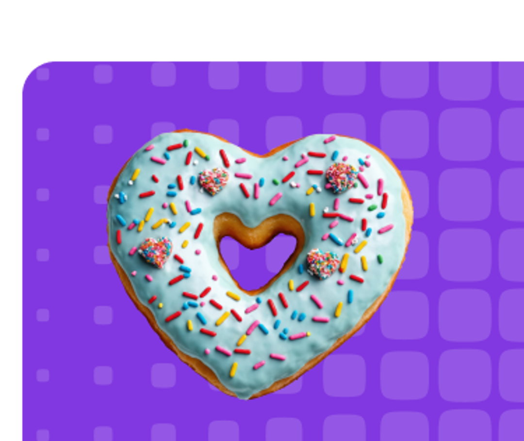 Doughnut in the shape heart with sprinkles on top