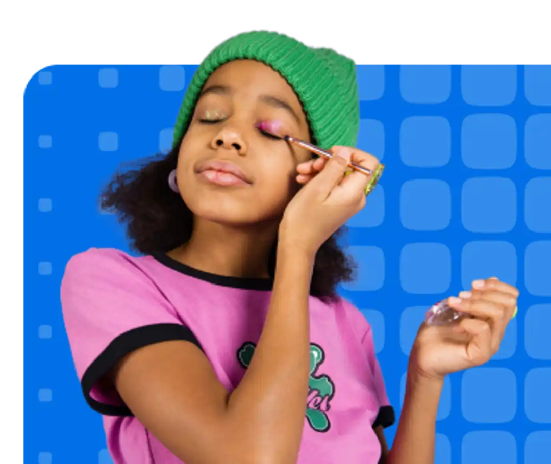 Young women putting on eye shadow